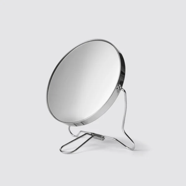 Whose reflection do you see in the mirror?